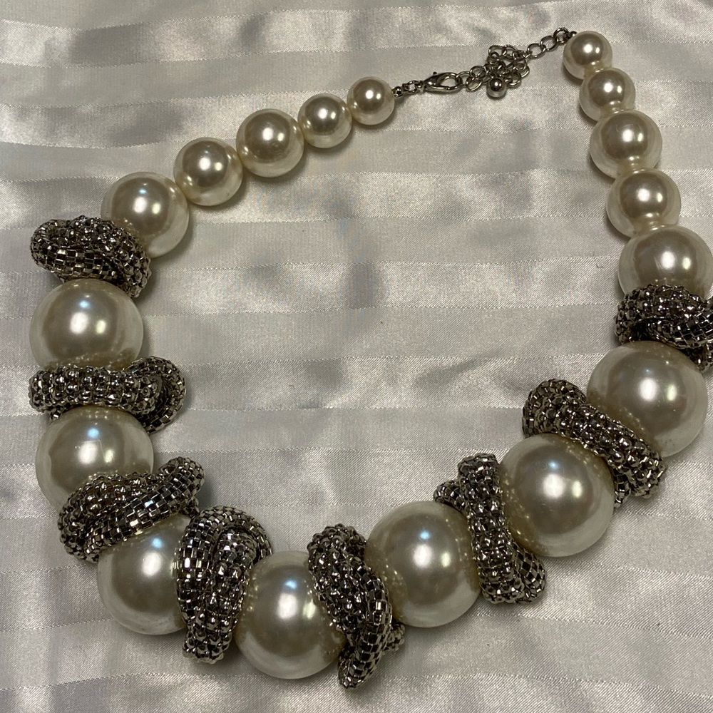Giant Pearls and twists of silver links adorn this exquisite necklace